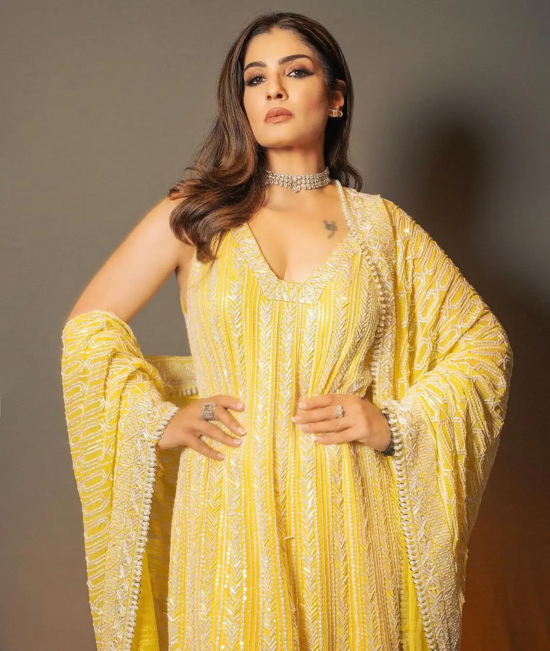 Raveena Tandon Wearing Beautiful Earring Yellow Gown